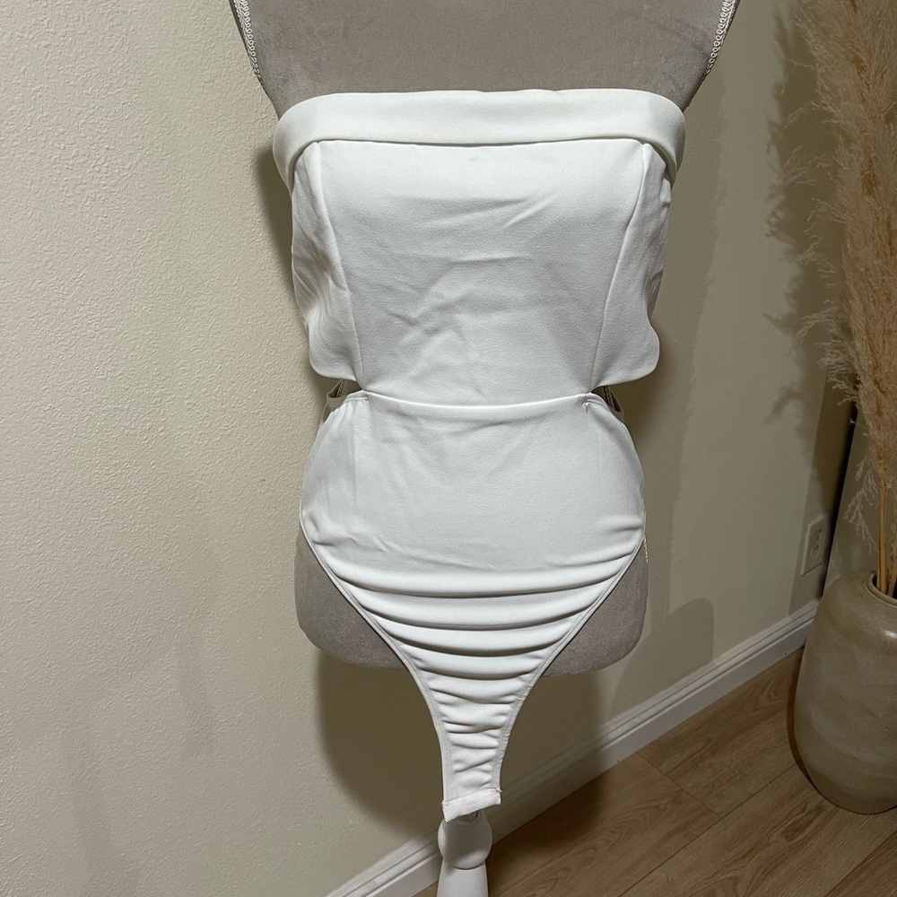 Princess Polly white bodysuit with side cutouts, size 8